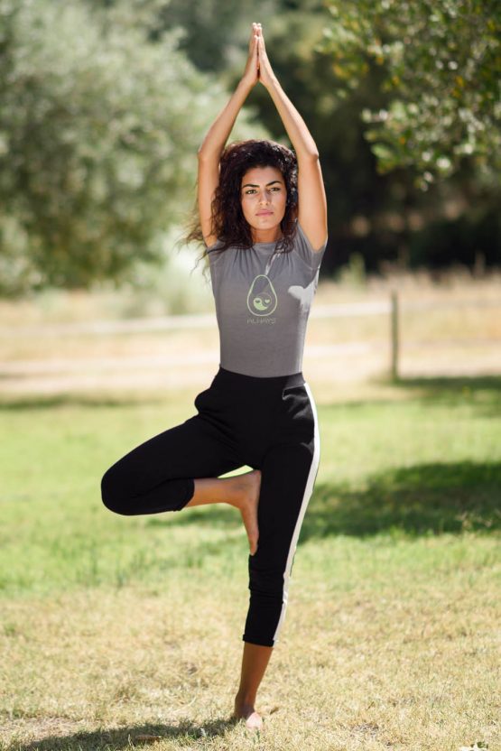 avocado-always-t-shirt-worn-by-a-woman-doing-yoga-outside-on-a-sunny-day