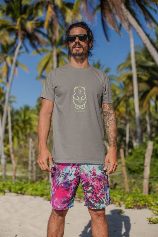 cali-avo-t-shirt-worn-by-a-man-with-surfer-shorts-standing-at-the-beach